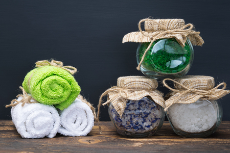 beautiful folded towels for the Spa and salt in a jar on the tableの写真素材