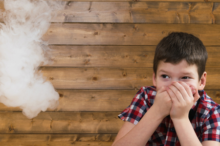 boy afraid of cigarette smoke suitable to itの写真素材