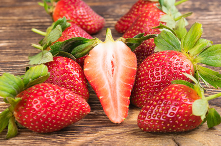 background red strawberry on a dark tableの写真素材