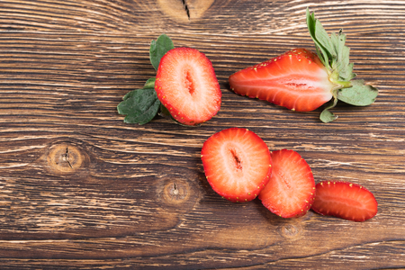 cutting strawberries beautifully put on burnt plankの写真素材