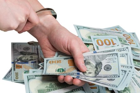 into the hands of wear handcuffs Dollar bribe, whiteの写真素材