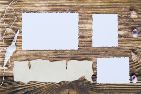 background for photos next to shells on the wooden tableの写真素材
