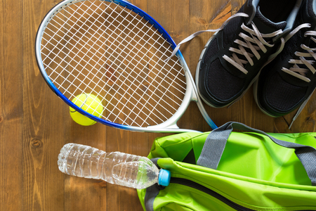 green bag for sports racket for tennis on the floorの写真素材