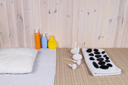 stones and bags for a massage on a tableの写真素材
