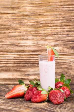 strawberry cocktail with milk on a dark boardの写真素材