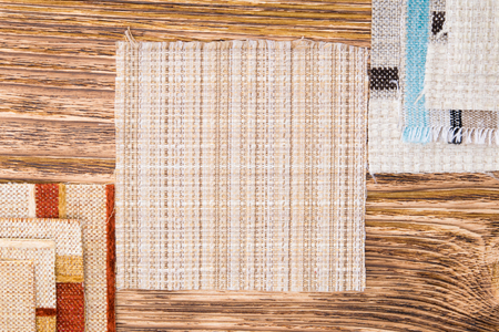 Different fabric laid out on the table as a backgroundの写真素材