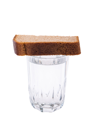 Mug with vodka and bread for mourning, concept isolated on white backgroundの写真素材