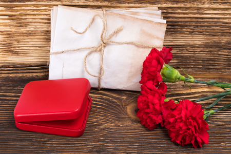 George's ribbon on the table with a red box and flowers, a beautiful victory cardの写真素材