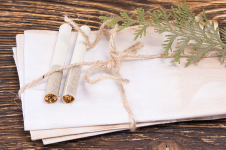 Old envelopes on the table with cigarettes conceptの写真素材