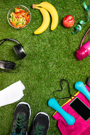 Sports nutrition set and things on a background of green grassの写真素材