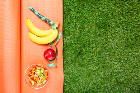 set of sports nutrition on the Mat , concept on green grassの写真素材