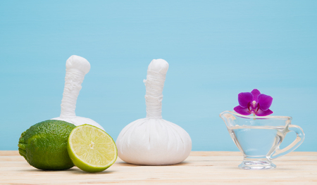 blue background with a set of bags and massage oil orchidの写真素材