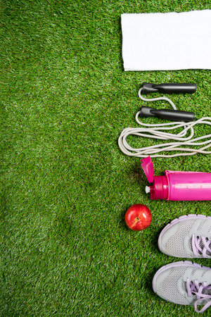 Set for sport on nature, concept on green background of grassの写真素材