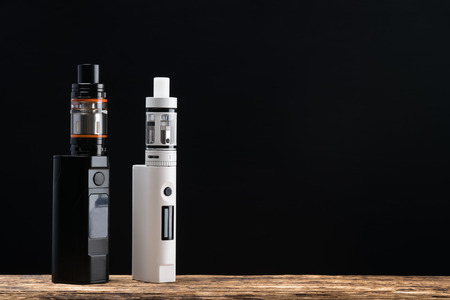 Two electronic cigarettes on a dark backgroundの写真素材