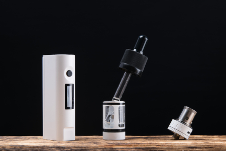 Concept of spare parts from an electronic cigarette on a dark backgroundの写真素材