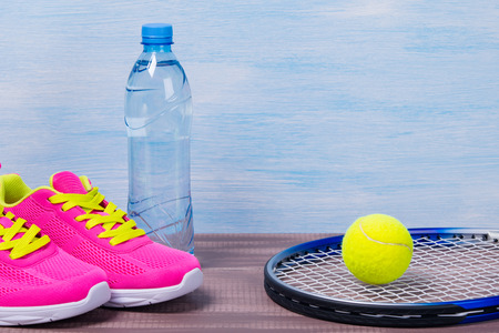 Set of sports items for playing tennis in a form of backgroundの写真素材