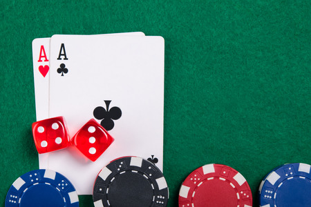 playing cards,dices and poker chips from  on green poker table