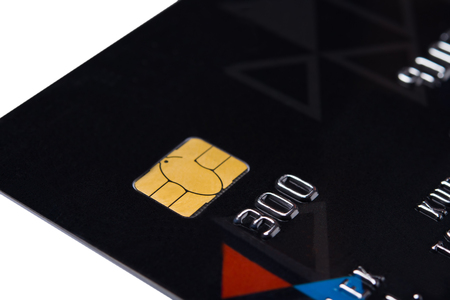 Card for payment online with a gold chip, on a white backgroundの写真素材