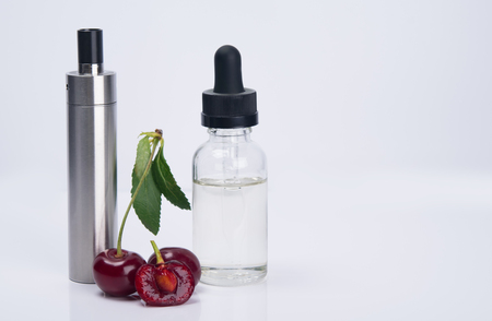 electronic cigarette and a filling liquid for it, on a white backgroundの写真素材