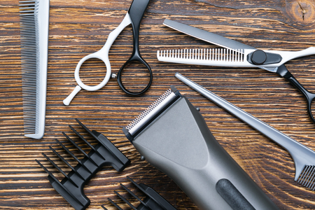 male set, for hair cutting, on a wooden background