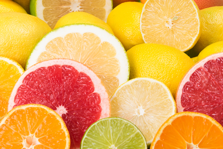 cut citrus fruits, concept of bright backgroundの写真素材