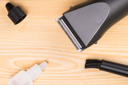 electric tool for the hairdresser on the desktop of woodの写真素材