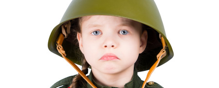 girl in military helmet, on white background, close-upの写真素材