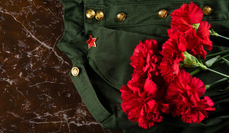 military clothing, cap and pinks, against the background of marbleの写真素材