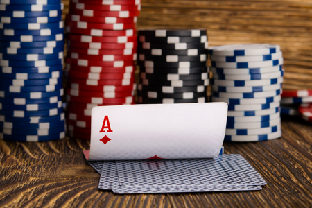 cards and poker chips, on a wooden background