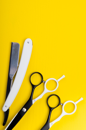 set of tools and items for hair care, and haircuts and shaving, on a yellow backgroundの写真素材