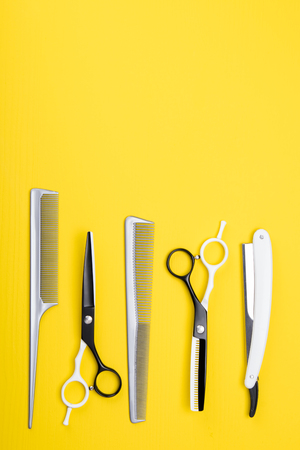 a set of tools and items for hair care, and haircuts, on a yellow backgroundの写真素材