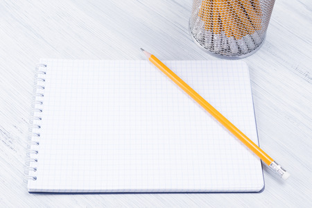 blank sheet for notes and pencils on a light background, close-upの写真素材