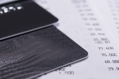 bank cards on a sales receipt from a store, background close-upの写真素材