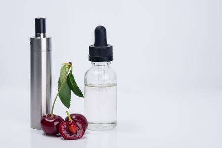 liquid for electronic cigarette, with a taste of cherry, on white backgroundの写真素材