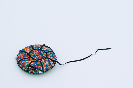 round inflatable sleigh for riding on snow on whiteの写真素材