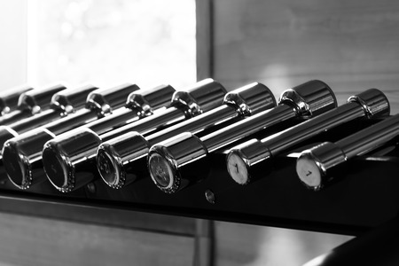 many dumbbells for fitness, close-up, black white photoの写真素材