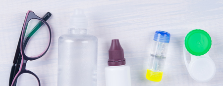 set of items for the care of contact lenses, for eyes, on a light gray backgroundの写真素材