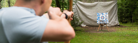 archery in the woods on the target rear view, long photoの写真素材