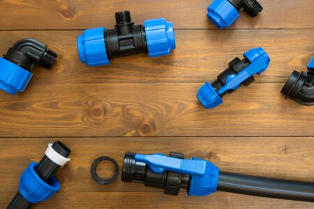 different parts for connections and assembly of water supply, background