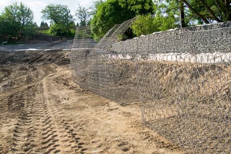 nets for stones are empty on the ground, ready for fillingの写真素材