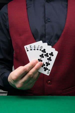 the dealer's hand is holding a black combination of winning cards