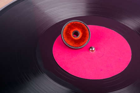 close-up of vinyl plastic with pink label and cleaning brush