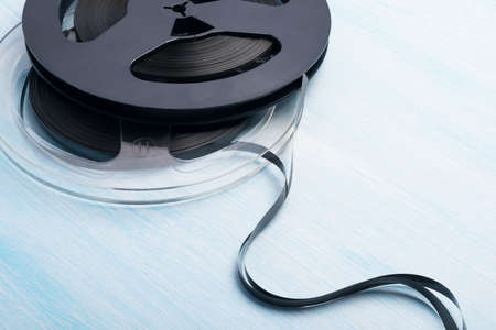 Two magnetic tape cassettes on blue