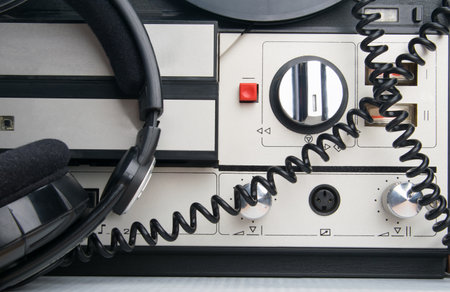 close - up of a retro magnetic tape player with headphones for listeningの写真素材