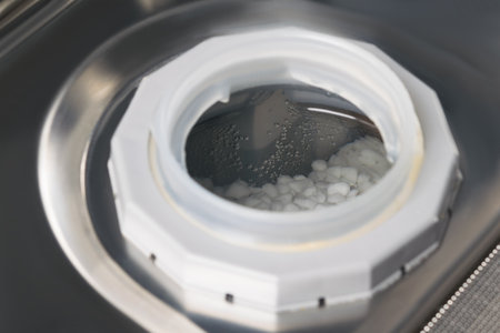 open compartment with salt for softening water in the dishwasher, close-upの写真素材