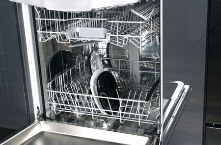 close-up of a dishwasher with black and white platesの写真素材