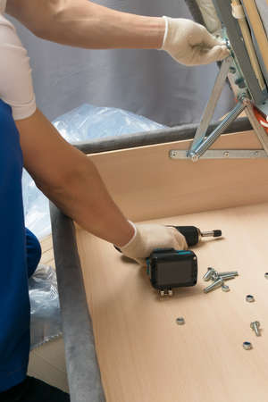 assembly and repair of light furniture in the houseの写真素材