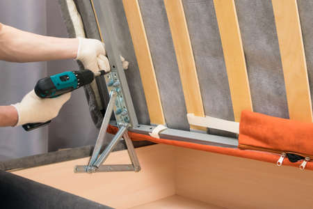 assembly of upholstered furniture after delivery, close-up viewの写真素材