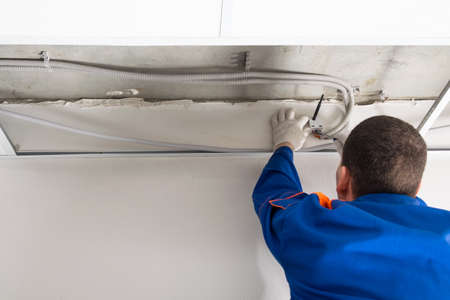installation of a video signal transmitter from video cameras in the ceiling of an office buildingの写真素材