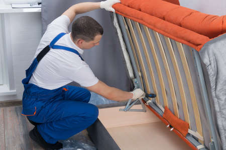 the master of sofa and bed maintenance repairs the mechanisms of the storage boxの写真素材